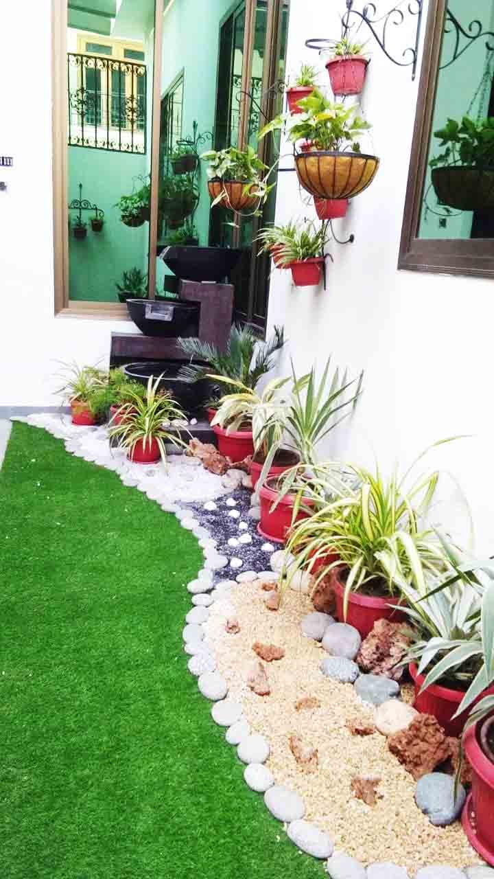 Garden rockery with a small water feature and surrounding planting